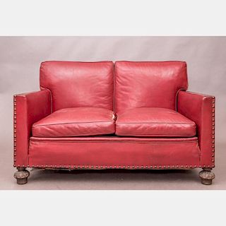 A Spanish Colonial Style Red Leather Settee, 20th Century.