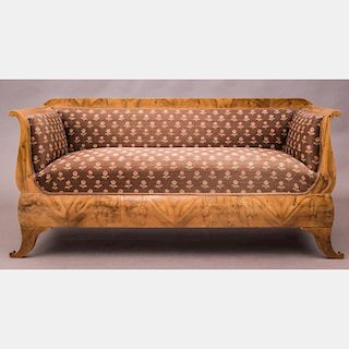 A Biedermeier Walnut Upholstered Canapé, 19th Century.