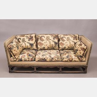 A Jacobean Style Carved Oak Sofa, 20th Century.