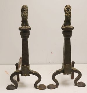 A Pair Of Hand Wrought Andirons With Lion Finials