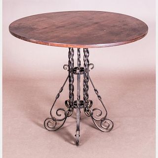 A Continental Wrought Metal and Walnut Top Circular Table, 20th Century.