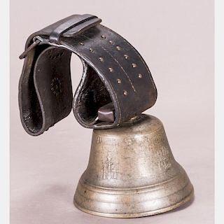 A Vintage Brass Cow Bell with Leather Strap, 20th Century.