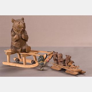 A Black Forest Carved Walnut Bear Form Ink Well on Sled, 20th Century.