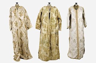 A Group of Three Traditional Moroccan Satin and Metallic Embroidered Kaftans, 20th Century.
