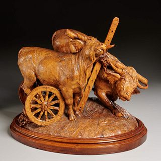 Fine and large Black Forest carved oxen and cart