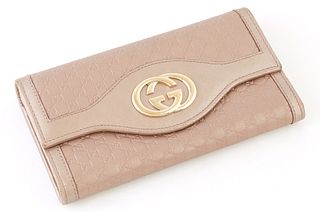 Gucci Metallic Light Pink Micro Guccissima Leather Sukey Continental Wallet, the calf leather with a golden brass Gucci logo on fron...