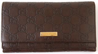 Gucci Dark Brown Long Wallet, the calf leather supreme shima leather with a golden brass accent snap, opening to three bill compartm...