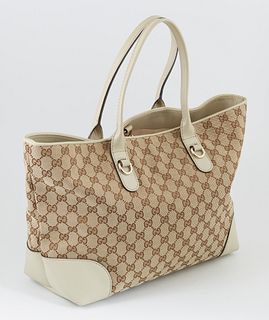 Gucci Beige Monogrammed Canvas and Ivory Leather Hearbit Tote, the exterior with golden brass and bamboo heart charm, opening to a l...