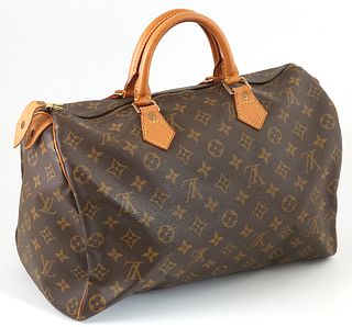 Louis Vuitton Brown Monogram Coated Canvas 35 Speedy Handbag, with golden brass hardware, opening to a brown canvas lined interior w...