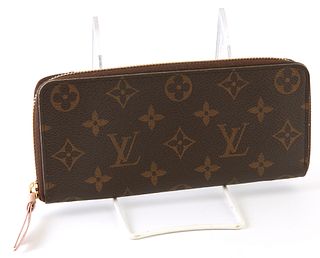Louis Vuitton Clemence Wallet, the brown and light pink coated canvas monogram canvas with a golden brass accent zipper and light pi...
