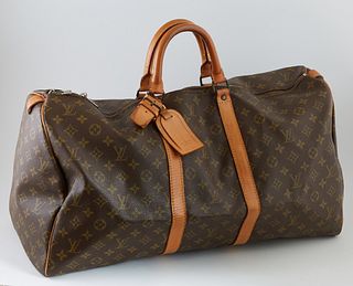 Louis Vuitton Brown Monogram Coated Canvas 55 Keepall Travel Bag, the vachetta leather handles with golden brass hardware and lock a...