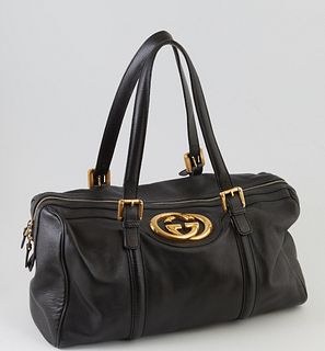 Gucci Black Smooth Leather Britt Boston Shoulder Bag, the exterior with golden brass hardware and large Gucci logo, the top zipper o...