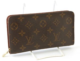 Louis Vuitton Men's Zippy Long Wallet, the brown coated monogram canvas with golden brass accent zippers, opening to two bill compar...