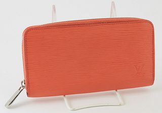 Louis Vuitton Coral Orange Zippy Wallet, the calf leather epi with a silver accent zipper, opening to two card holders, a zip pouch,...