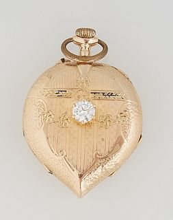 Lady's 14K Yellow Gold Heart Shaped Pendant Watch, early 20th c., by Hesperus, with engraved decoration, the lid with a central .5 c...