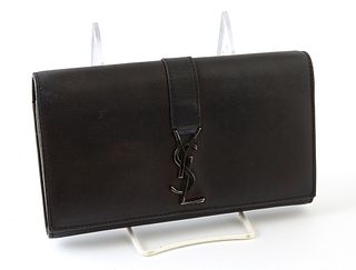 Yves Saint Laurent Front Logo Zip Long Wallet, the black smooth calf leather with black YSL logo accent, opening to four bill compar...