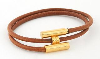Hermes Tournis Bracelet, with gold stainless hardware and brown calf leather band, Dia.- 2 1/4 in.