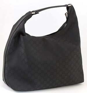 Gucci Black Canvas Large Hobo Shoulder Bag, with gold hardware, the interior of the bag lined in black canvas with a side zip closur...