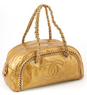 Chanel Metallic Gold Patent Leather Zip Logo Bowler Bag, c. 2006, with double chain handles interlaced with metallic gold leather an...