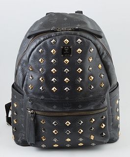 MCM Black Coated Canvas Studs Star Backpack, with gold and silver hardware, the interior fo the bag lined in black monogram nylon, w...