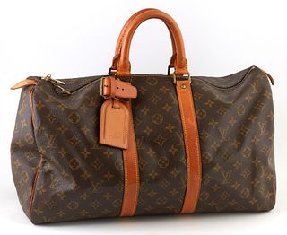 Louis Vuitton Brown Monogram Coated Canvas 45 Keepall Travel Bag, the vachetta leather straps and luggage tag with golden brass hard...