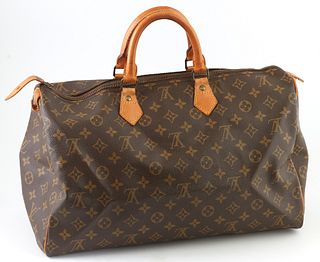 Louis Vuitton Brown Monogram Coated Canvas 40 Speedy Handbag, with golden brass hardware and vachetta leather handles, opening to a ...