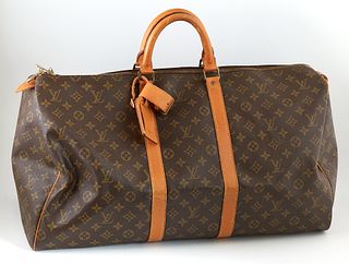 Louis Vuitton Brown Monogram Coated Canvas 55 Keepall Travel Bag, the vachetta leather handles with golden brass hardware, opening t...