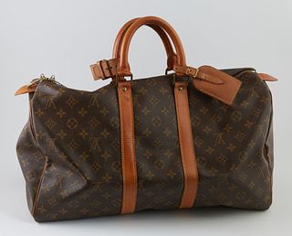 Louis Vuitton Brown Monogram Coated Canvas 45 Keepall Travel Bag, the vachetta leather straps with golden brass hardware and vachett...