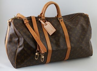 Louis Vuitton Brown Monogram Coated Canvas 55 Keepall Bandouliere Travel Bag, the vachetta leather handles and adjustable strap with...