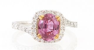 Lady's 18K White Gold Dinner Ring, with an oval 1.39 ct. pink sapphire atop a square border of round diamonds, the shoulders of the...