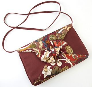 Gucci Bordeaux Floral Silk Envelope Shoulder Bag, with golden brass accents and bow decoration, the snap enclosure opening to a gold...