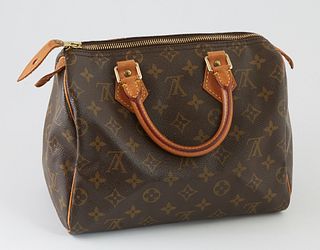 Louis Vuitton Brown Monogram Coated Canvas 25 Speedy Handbag, with golden brass hardware, opening to a light brown canvas lined inte...