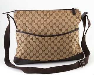 Gucci Monogrammed Canvas Large Messenger Bag, with a perforated brown calf leather bottom and front snap close pocket, the interior ...