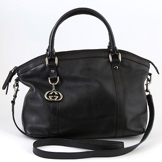 Gucci Black Grained Leather Interlocking Charm Convertible Tote, the exterior with gun metal hardware and charm, two leather handles...