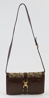 Celine Monogrammed Canvas Triple Zip Sling Bag, with an adjustable dark brown leather shoulder strap and gold hardware, the interior...