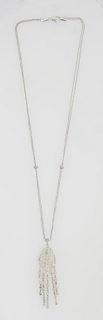 14K White Gold Necklace, with a pierced pave diamond mounted pendant, suspending five diamond mounted tassels, on a double tiny link...