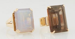 Two 18K Yellow Gold Lady's Dinner Rings, one with a large emerald cut moonstone, atop a wide tapered pierced band, size 6 1/4; the s...