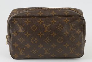 Louis Vuitton Brown Monogram PM Coated Canvas Toiletry Pouch, the brass zipper opening to large compartment with side pocket and thr...
