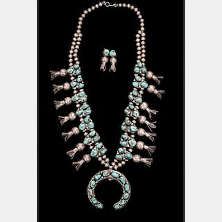 A Navajo Squash Blossom Silver and Turquoise Necklace with Matching Earrings.
