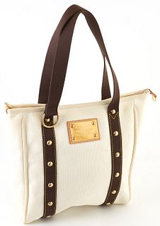 Louis Vuitton Ivory and Brown Canvas MM Antigua Cabas Shoulder Bag, the exterior with yellow stitching on brown straps and golden br...