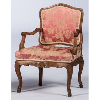 A Continental Fruitwood Fauteuil with Spanish Feet