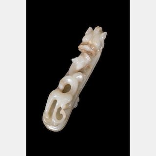 A Chinese Carved Celadon Jade Belt Hook, 19th/20th Century.