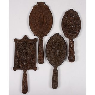 Four Ornate Thermoplastic Hand Mirrors with Figural and Floral Designs