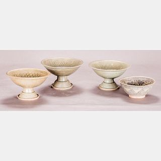 A Group of Four South East Asian Celadon Earthenware Footed Bowls.