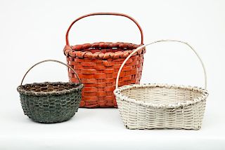 Red-Stained Woven Wood Splint Basket, a Dark Green-Stained Basket, and a White Wicker Basket