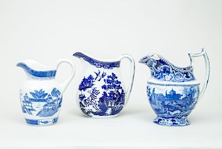 Three Blue Transfer-Printed Pitchers, in the Willow Pattern
