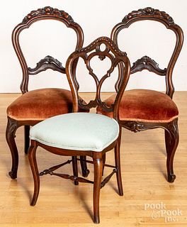 Three Victorian carved walnut side chairs