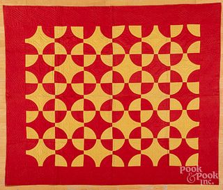 Red and yellow pieced quilt