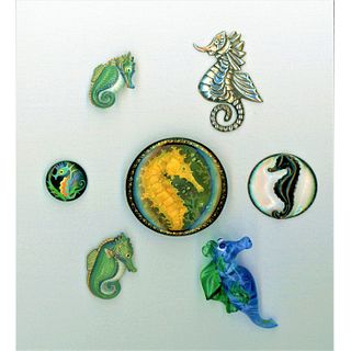 A Small Card Of Assorted Material Seahorse Buttons