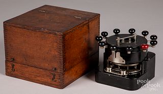 Williams Automatic Bank Punch, in an oak case